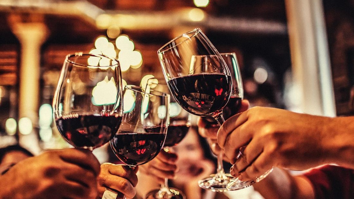 People celebrating with wine glasses